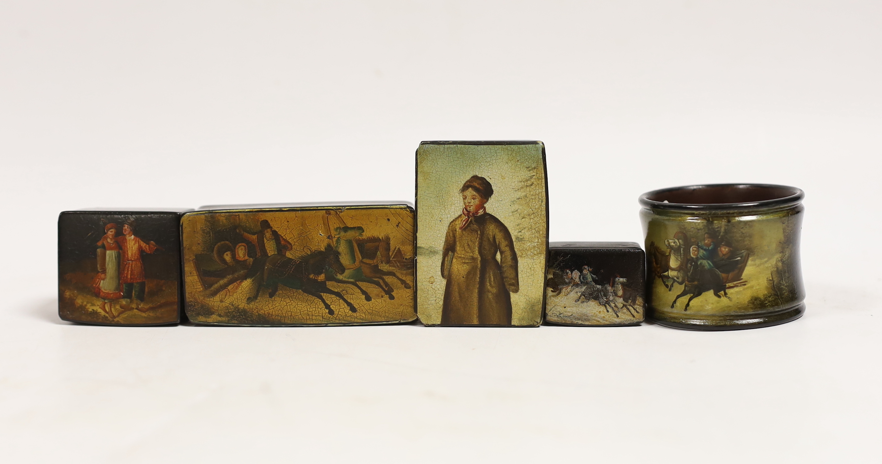 Four small Russian lacquer snuff boxes and a napkin ring, by Vishnyakov, painted with Troika and figure scenes, largest 7.7 cm wide (5)